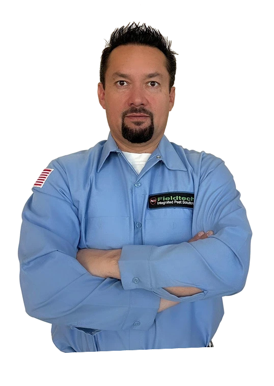 Fieldtech Integrated Pest Solutions pest control technician in uniform with arms crossed ready to serve Apple Valley and High Desert CA customers